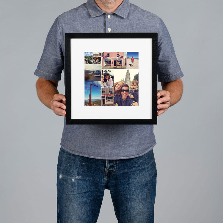 A man holds up a framed custom photo collage. The frame is black with a white mat, showcasing a bespoke collage design of various travel and portrait photographs.