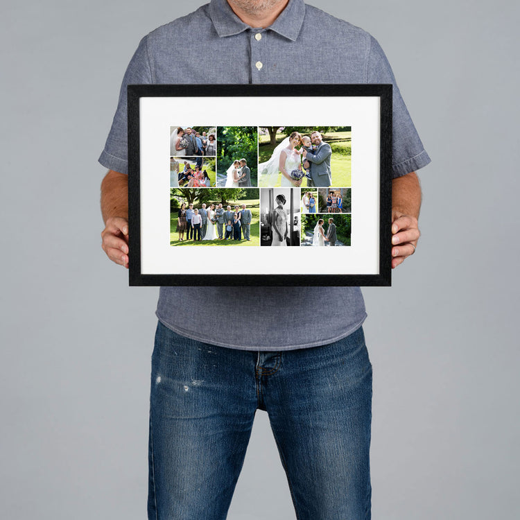 A man holds a black-framed custom photo collage print with a white mat. The collage contains multiple wedding and couple photos. The print is 30x20cm and the frame is 44x34cm. 